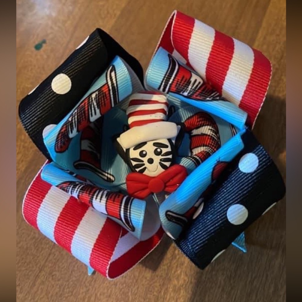 Dr Seuss bow on a clip. Snug as a Bug small shop made it